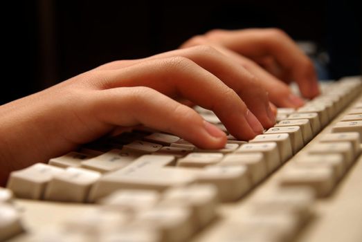 Photo of hands working on a keyboard in the internet