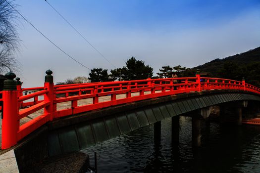 A red bridge over water Japan