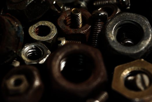 Close-up photo of the numerous rusty screws and hardware