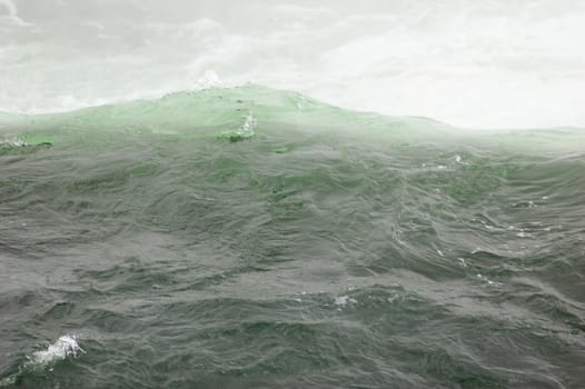 Blue-green water, falling down from Niagara falls.