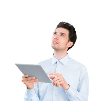 Portrait of a young handsome businessman holding tablet computer and looking up. Isolated on white background