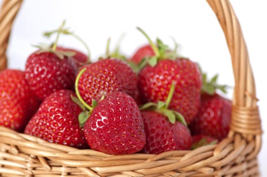 Fresh strawberries in the basket on white background