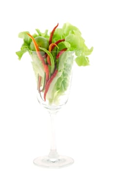 fresh chili , lime and lettuce  in glass on white background