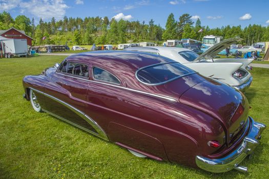 Mercury Coupe, custom 1949 model. The car is in amazingly good condition and perfect in the paint. The image is shot at dawn at the farm in Halden, Norway.