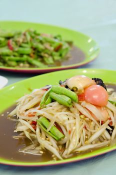 close up spicy papaya salad with crab and spicy cowpea salad