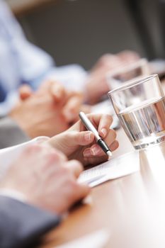 Close up of hands of business people during a meeting