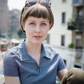 young beautiful hipster woman in the city