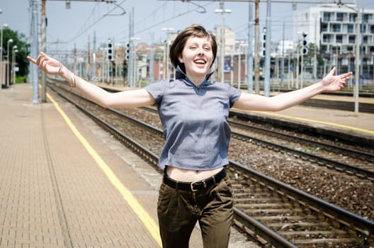 young beautiful hipster woman happy running in the station