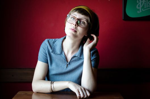 young beautiful hipster woman at the bar
