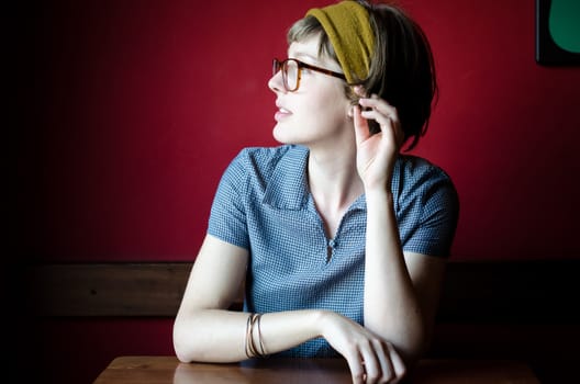 young beautiful hipster woman at the bar
