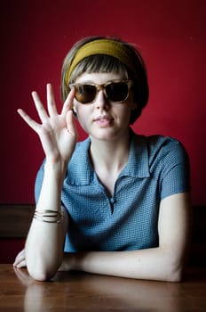 young beautiful hipster woman at the bar