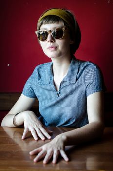 young beautiful hipster woman at the bar