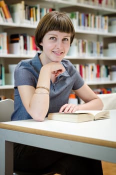 young beautiful hipster woman in library