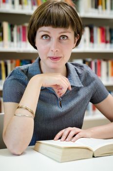 young beautiful hipster woman in library