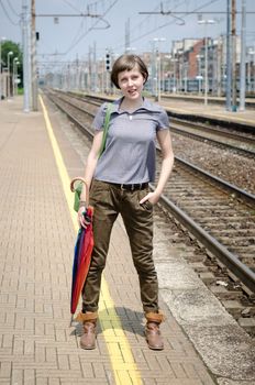 young beautiful hipster woman in railway station
