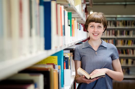 young beautiful hipster woman in library