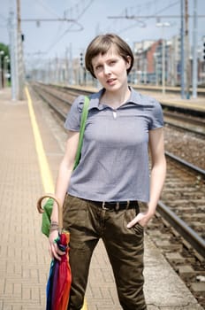 young beautiful hipster woman in railway station