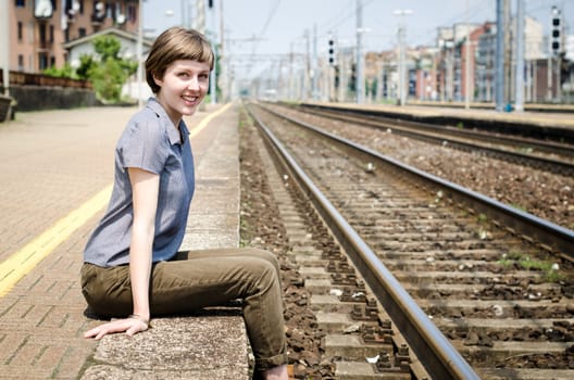 young beautiful hipster woman at the station