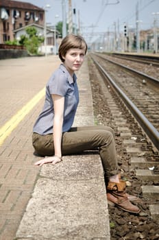 young beautiful hipster woman at the station