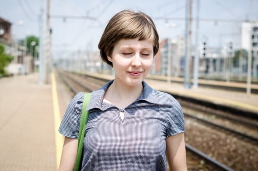 young beautiful hipster woman in station