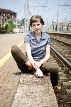 young beautiful hipster woman at the station