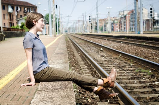 young beautiful hipster woman at the station