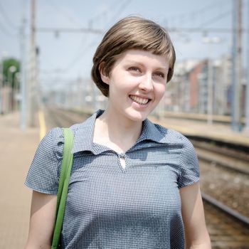 young beautiful hipster woman at the station