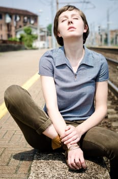 young beautiful hipster woman at the station