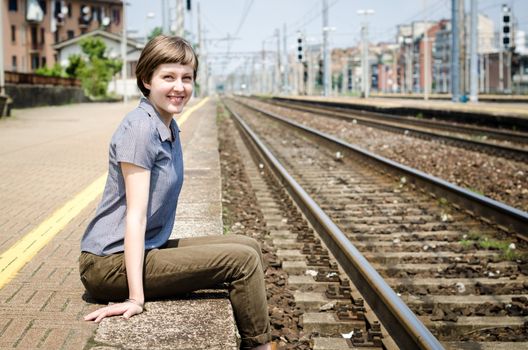 young beautiful hipster woman at the station