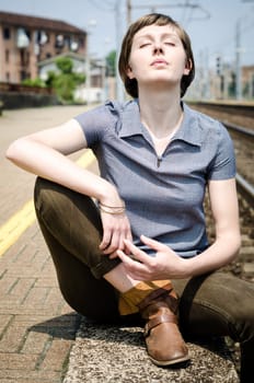 young beautiful hipster woman at the station