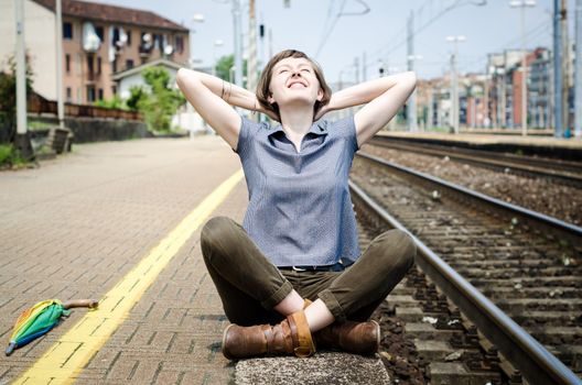 young beautiful hipster woman at the station