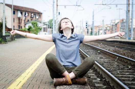 young beautiful hipster woman at the station