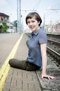 young beautiful hipster woman at the station