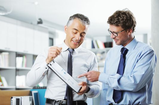 Business colleagues discussing together in an office