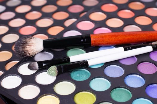 Colorful set of professional eye shades wit brushes