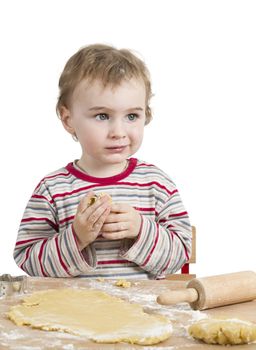 cute child with dough and rolling pin isolated on white background. horizontal image