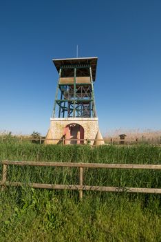 Birdwatching tower amidst wetlands of a natural park