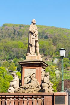 Statue of Karl Theodor from 1792 one of elector builders of old bridge leading to ancient town city of Heidelberg Germany