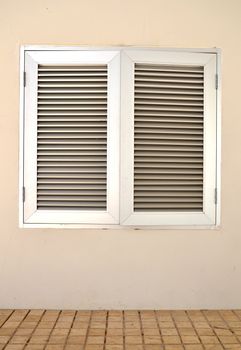 An industrial ventilation fan attached to a building