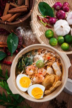 Prawn noodles, prawn mee. Famous Malaysian food har mee spicy fresh cooked in clay pot with hot steam.