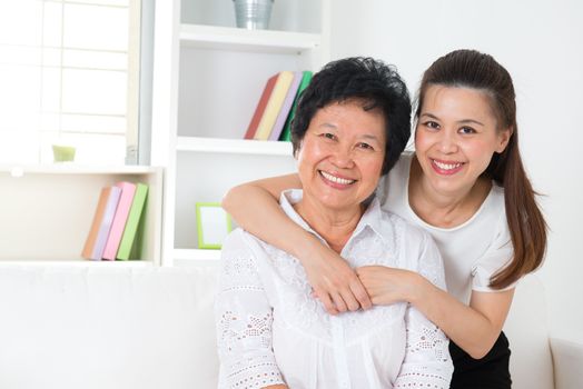 Senior woman and daughter. Happy Asian family senior mother and adult offspring having fun time at home.