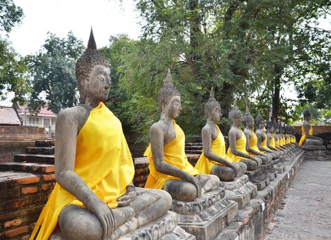 Ancient Buddha statues at Wat Yai Chai Mongkol in Ayutthaya, Thailand 