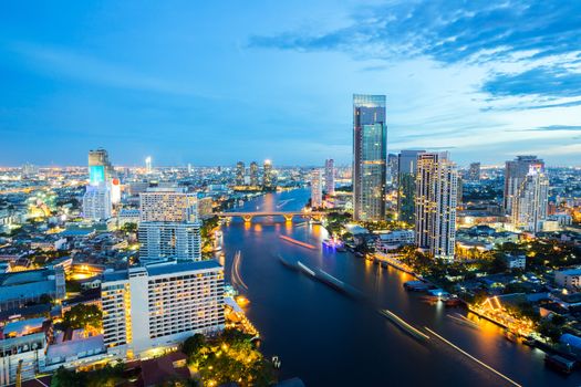 Aerial view of Bangkok Skyline along Chaophraya River sunset twilight