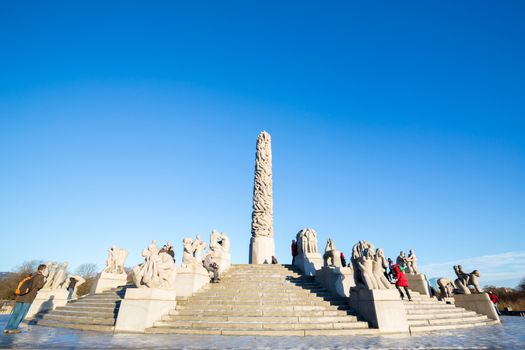 OSLO NORWAY- JANUARY 1: Visitors enjoying the statues created by Gustav Vigeland in the popular Vigeland park in Oslo, Norway on January 1, 2013.