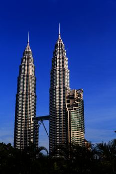 KUALA LUMPUR - JUN 6: View of The Petronas Twin Towers on Jun 6, 2012 in Kuala Lumpur, Malaysia. This famous landmark of Malaysia are the tallest twin buildings in the world (451.9 m).