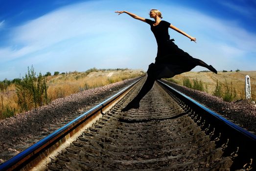 Wide-angle photo of the ballet dancer jumping