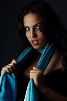 Sexy lady with blue scarf expressing alertness