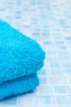 Blue Bath Towels on Blue Bathroom Tiles