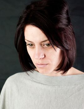 conceptual portrait of stressed abused young woman 