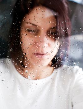 conceptual portrait of stressed abused young woman 